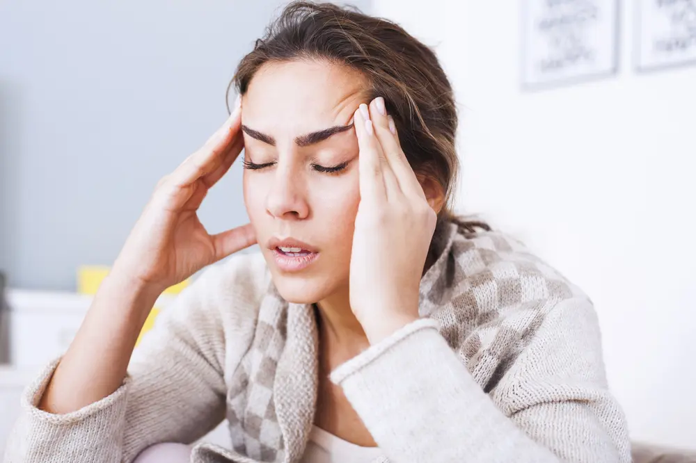 Woman with a headache.