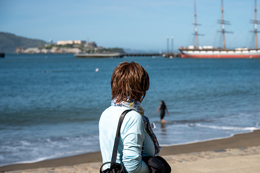 Woman overlooking San Francisco Bay on a sunny day